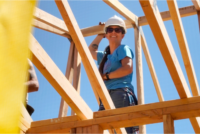 Woman building a roof